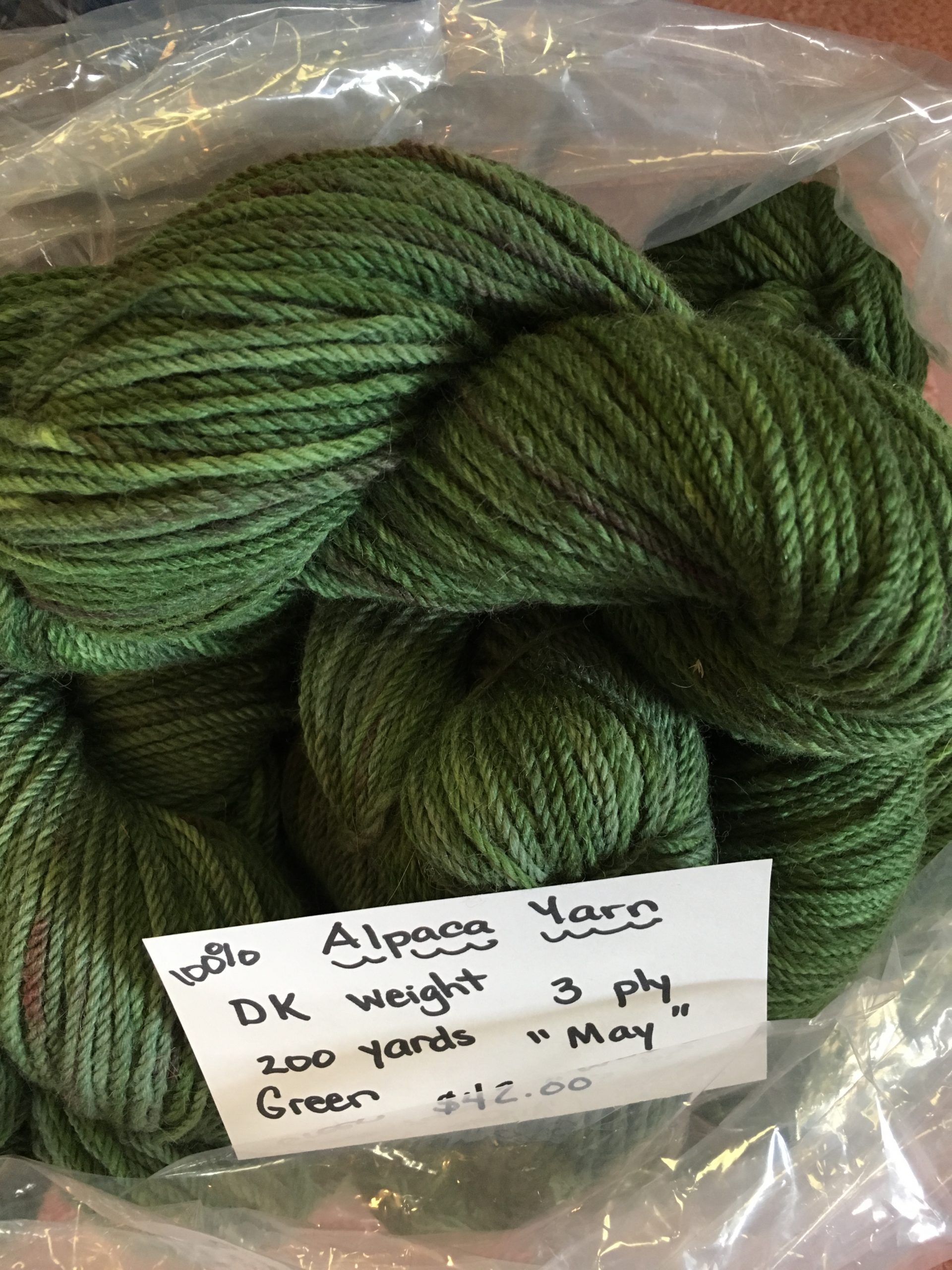 Yarn: Variegated dark green alpaca DK yarn